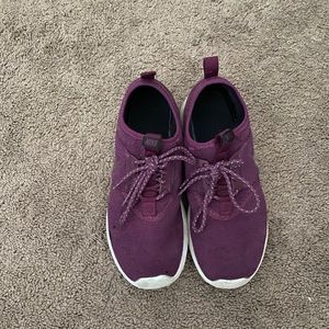 Purple Nike running shoes